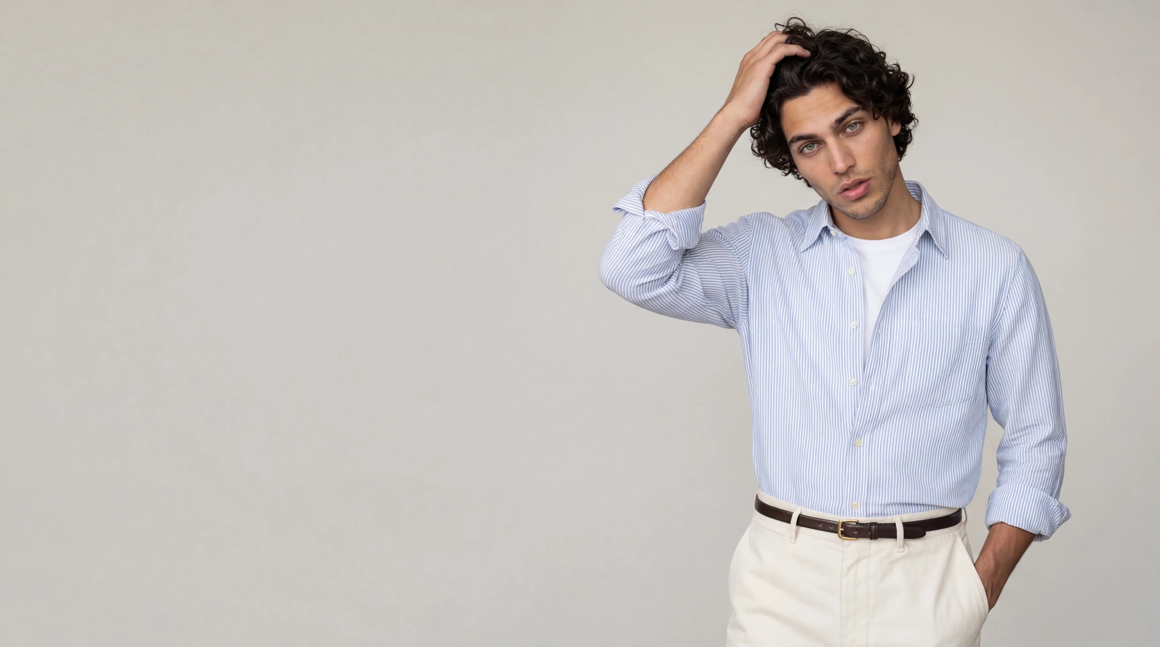 Man in light blue linen shirt and white trousers — AI apparel product photography for ecommerce